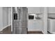 Bright kitchen with stainless steel appliances, including a large refrigerator and adjacent countertops with appliances at 450 S Parliament Way, Clayton, NC 27520