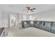 Spacious living room with neutral walls, plush seating, and recessed lighting for a bright, inviting space at 450 S Parliament Way, Clayton, NC 27520