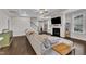 Comfortable living area featuring a large sectional couch and fireplace at 450 S Parliament Way, Clayton, NC 27520