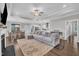 Cozy living room with a large sectional sofa and an open-concept design at 450 S Parliament Way, Clayton, NC 27520