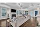 Inviting living room with fireplace, large windows, and hardwood flooring at 450 S Parliament Way, Clayton, NC 27520