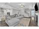 Bright living room showcases an open floor plan with access to the kitchen and stairs at 450 S Parliament Way, Clayton, NC 27520