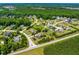 Aerial view showcasing the property's location within a desirable neighborhood, surrounded by mature trees and well-maintained lawns at 4621 Basilica Dr, Holly Springs, NC 27540