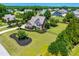 Beautiful brick home with lush landscaping and a large, well-maintained lawn in a desirable neighborhood at 4621 Basilica Dr, Holly Springs, NC 27540