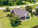 Aerial shot of backyard featuring outdoor seating, lush lawn, and mature landscaping for privacy at 4621 Basilica Dr, Holly Springs, NC 27540