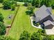 Expansive backyard with a patio and beautifully landscaped grounds, perfect for outdoor living at 4621 Basilica Dr, Holly Springs, NC 27540