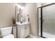 Cozy bathroom with a walk-in shower, vanity, and neutral color scheme at 4621 Basilica Dr, Holly Springs, NC 27540
