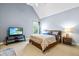Well-lit bedroom with a high ceiling and a TV, creating a relaxing space at 4621 Basilica Dr, Holly Springs, NC 27540