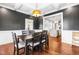 Dining room with elegant dark grey walls, and bright white trim at 4621 Basilica Dr, Holly Springs, NC 27540