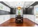 Formal dining room featuring wainscoting, decorative lighting, and natural light at 4621 Basilica Dr, Holly Springs, NC 27540