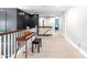 Open hallway featuring piano, white wainscotting, and recessed lighting at 4621 Basilica Dr, Holly Springs, NC 27540