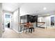 Hallway with hardwood floors and piano for entertaining and relaxation at 4621 Basilica Dr, Holly Springs, NC 27540