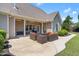 Back patio with outdoor seating, ceiling fan, and outdoor cooking area at 4621 Basilica Dr, Holly Springs, NC 27540