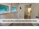 Bonus room leading to full bath features natural light from two windows, sconce lighting, and fresh carpet at 4720 Rivermont Rd, Durham, NC 27712