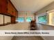 Versatile bonus room features natural light, built-in shelves, and ample space for a home office at 4720 Rivermont Rd, Durham, NC 27712