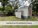 Exterior shot of back of house and storage shed at 4720 Rivermont Rd, Durham, NC 27712