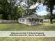 Quaint home with a welcoming porch and a spacious front yard at 4720 Rivermont Rd, Durham, NC 27712