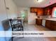 Eat-in kitchen area featuring seating and tile floors at 4720 Rivermont Rd, Durham, NC 27712