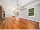 Spacious basement area with brick fireplace, hardwood floors, and natural light at 4909 Brookhaven Dr, Raleigh, NC 27612