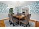 Elegant dining room with floral wallpaper and chandelier at 4909 Brookhaven Dr, Raleigh, NC 27612