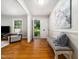 Bright foyer with hardwood floors and stylish bench at 4909 Brookhaven Dr, Raleigh, NC 27612