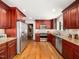 Updated kitchen with stainless steel appliances and wood cabinets at 4909 Brookhaven Dr, Raleigh, NC 27612