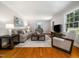 Cozy living room with neutral tones and natural light at 4909 Brookhaven Dr, Raleigh, NC 27612