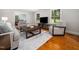 Inviting living room with hardwood floors and ample windows at 4909 Brookhaven Dr, Raleigh, NC 27612