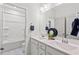 Bright bathroom with double sink vanity and modern chrome fixtures, complemented by stylish decor at 509 Rain Drizzle Ct, Wake Forest, NC 27587