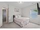 Inviting bedroom featuring a comfortable bed and ample natural light from a large window at 509 Rain Drizzle Ct, Wake Forest, NC 27587