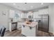 Modern kitchen with stainless steel appliances and white cabinets at 509 Rain Drizzle Ct, Wake Forest, NC 27587