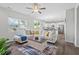 Bright living room featuring an open floor plan, hardwood floors, and modern decor at 509 Rain Drizzle Ct, Wake Forest, NC 27587