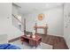 Inviting living room showcasing hardwood floors, modern decor, and an open staircase at 509 Rain Drizzle Ct, Wake Forest, NC 27587