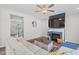 Inviting living room with a fireplace, hardwood floors, and modern decor at 509 Rain Drizzle Ct, Wake Forest, NC 27587