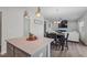 Open-concept living room with dining area, modern lighting, and fireplace at 509 Rain Drizzle Ct, Wake Forest, NC 27587
