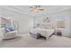 Spacious main bedroom with a tray ceiling, large windows, and neutral decor at 509 Rain Drizzle Ct, Wake Forest, NC 27587