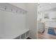 Mudroom with built in bench and storage opening up to a modern kitchen at 509 Rain Drizzle Ct, Wake Forest, NC 27587
