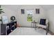 Bright office space with a faux fur rug, a chair and a large window at 509 Rain Drizzle Ct, Wake Forest, NC 27587