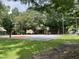 Well-maintained community basketball court, shaded by mature trees for recreational activities and gatherings at 517 Bart St, Raleigh, NC 27610