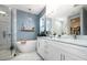 Serene bathroom with freestanding tub, marble tile, and elegant fixtures at 517 Bart St, Raleigh, NC 27610