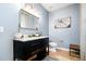 Stylish bathroom features a modern vanity with marble countertop and a decorative mirror at 517 Bart St, Raleigh, NC 27610