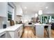 Bright, all-white kitchen featuring stainless steel appliances and a functional center island at 517 Bart St, Raleigh, NC 27610