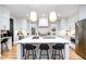 Spacious kitchen with white cabinetry, stainless appliances, and a large center island with bar seating at 517 Bart St, Raleigh, NC 27610