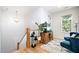 Bright landing area with wooden staircase, stylish decor, and natural light from the window at 517 Bart St, Raleigh, NC 27610
