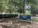 Roberts Park sign with lush trees in background, providing residents space to relax at 517 Bart St, Raleigh, NC 27610