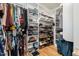 Organized walk-in closet with custom shelving for clothes, shoes, and accessories at 517 Bart St, Raleigh, NC 27610