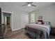 Bedroom features wood-look floors, neutral paint, white trim, and a ceiling fan at 5402 Shealtiel Way, Rougemont, NC 27572