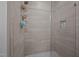 Bathroom shower featuring tile walls, built-in niche, and glass door at 5402 Shealtiel Way, Rougemont, NC 27572