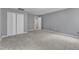 Bedroom with neutral walls, large closet doors and carpet flooring at 5603 Whisperwood Dr, Durham, NC 27713