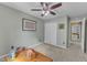 Bedroom featuring a ceiling fan, and closet with views of the bedroom and bathroom at 5603 Whisperwood Dr, Durham, NC 27713